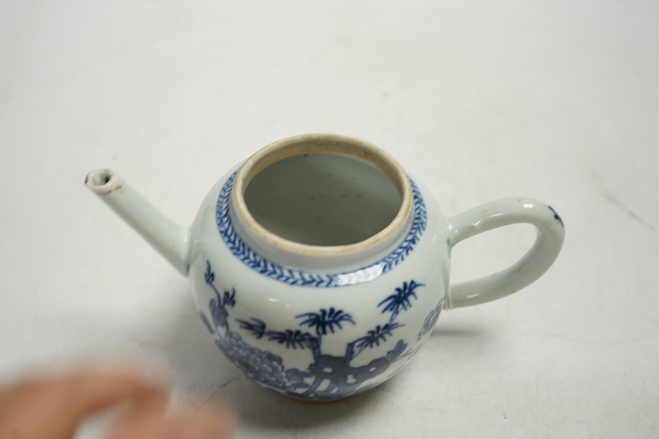 A Chinese blue and white teapot and cover, Qianlong period, 13cm high. Condition - fair